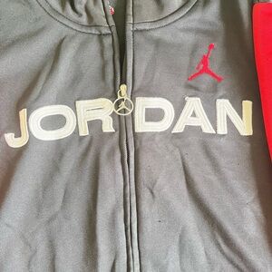 Jordan vintage zip up all black with red lines down sleeve